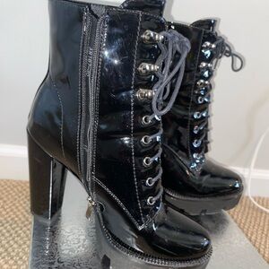 BRAND NEW black booty heels with zipper